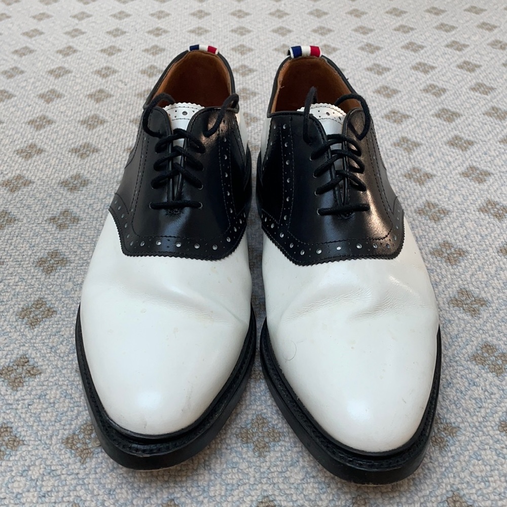 Elegant pair of Thom Browne Men’s Black and White Saddle Shoes